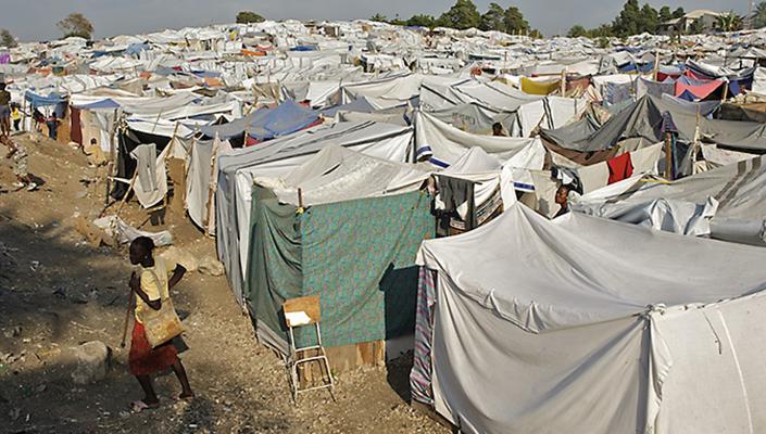 tent structures built close together stretch across the distance, filling the photo frame