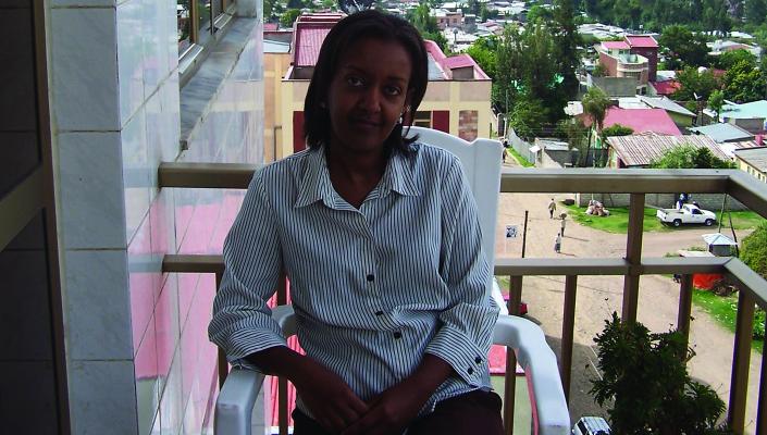 Aida Abashawl sits on a balcony in Addis Ababa