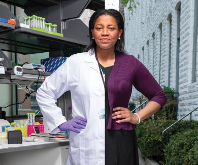 Photograph of Brittany Jenkins-Lord. Half of her body is in a lab wearing a lab coat, the other half is in a dress standing outside on a street.