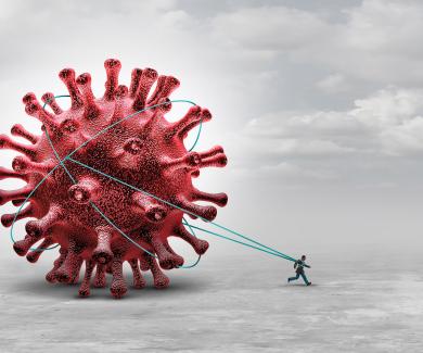 An illustration of a person pulls a giant SARS-CoV-2 virus behind them like a weight.
