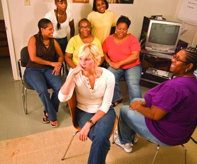 Kathy Dolan and Tiffany Walker-Hill lead discussions with five women