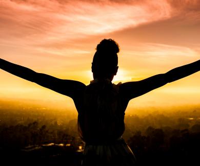 picture of woman with arms outstretched