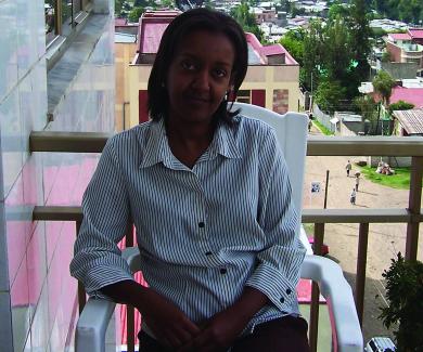 Aida Abashawl sits on a balcony in Addis Ababa