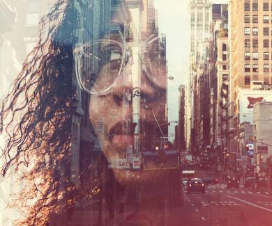 Person of color superimposed over a city streetscape.