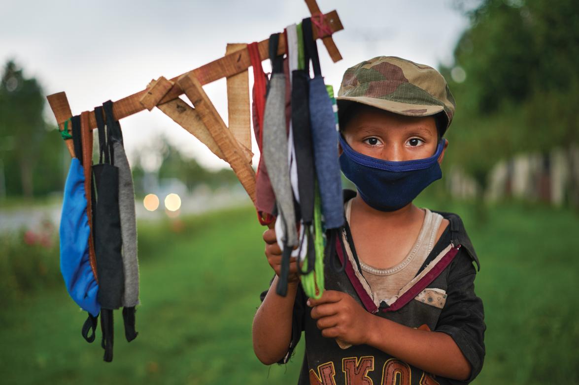 Ramazan, 9, selling masks in Islamabad, Pakistan